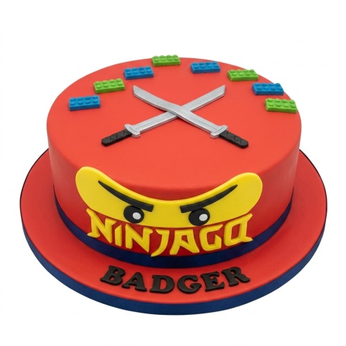 Red Ninjago theme birthday cake with yellow character face, crossed swords, and colourful Lego bricks.