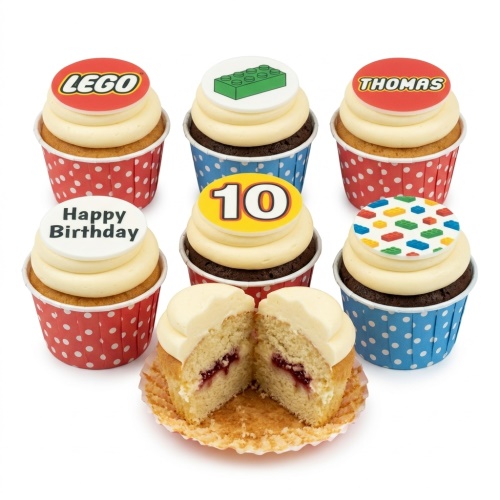Cupcakes with Lego, building block, 'Happy Birthday', and '10' toppers in red and blue polka dot cases.