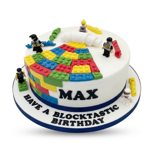 White round birthday cake decorated with colourful edible Lego and small minifigure characters, with a personalised message.