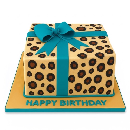Square leopard print birthday cake with a teal ribbon and bow, styled as a gift.