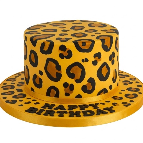 Round single-tier cake with yellow, black, and brown leopard print, 'Happy Birthday' message on board.