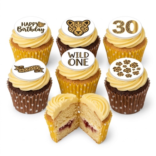 Cupcakes with leopard print toppers, including a leopard head, "Happy Birthday", "Wild One", and a custom age "30".