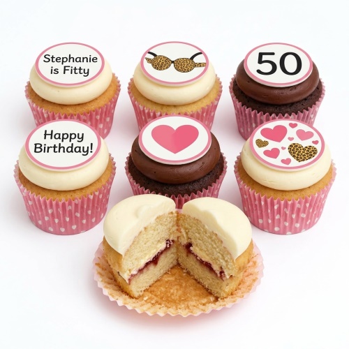 A selection of leopard print and heart themed birthday cupcakes with white and chocolate frosting, and a custom age topper.