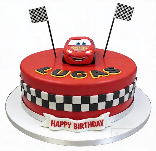 Red round birthday cake with Lightning McQueen topper, two checkered flags, and a black and white checkered band.