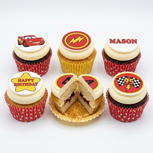 Lightning McQueen themed cupcakes with racing flags, lightning bolts, and custom message toppers.