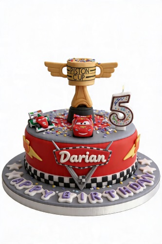 Red Disney Cars birthday cake with Piston Cup, Lightning McQueen, racing car, and custom age candle.