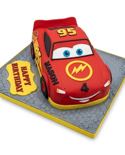 Red 3D Lightning McQueen car birthday cake with '95' and 'Happy Birthday' plaque.