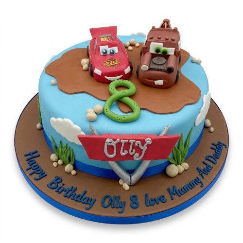 Round Disney Cars birthday cake with Lightning McQueen and Mater figures, custom age topper, and personalised name banner.