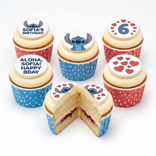 Six Stitch themed birthday cupcakes with custom age and message toppers, in red and blue polka dot cases.