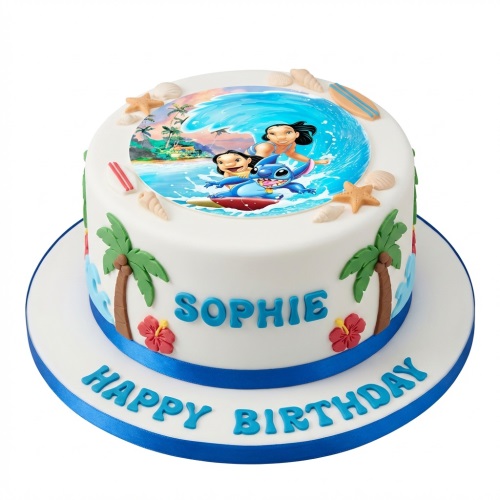 Round white birthday cake with Lilo and Stitch surfing edible topper, fondant palm trees, hibiscus flowers, seashells, and surfboards.