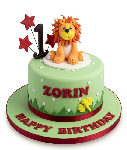 Green jungle theme birthday cake with 3D lion topper, red stars, and number 1 topper.
