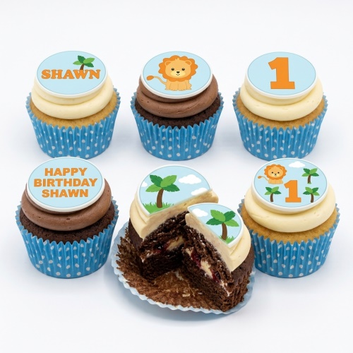Jungle safari cupcakes with lion, palm tree, and custom age toppers on vanilla and chocolate cupcakes.