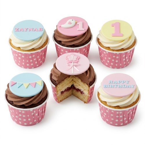 Baby birthday cupcakes with pastel toppers, bird, flower, bunting, and custom age/name options.