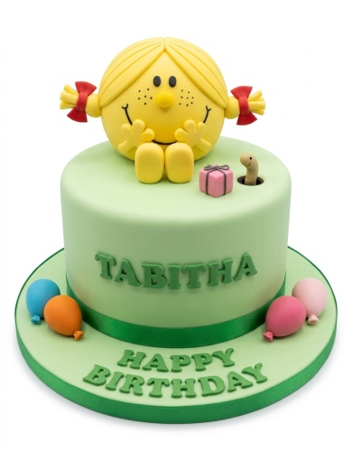 Round light green fondant cake with a yellow Little Miss character on top, a pink gift, a worm, and colourful balloons on the board.