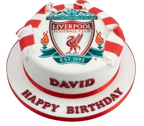 Round white cake with Liverpool FC crest, red and white scarf, and red ribbon.