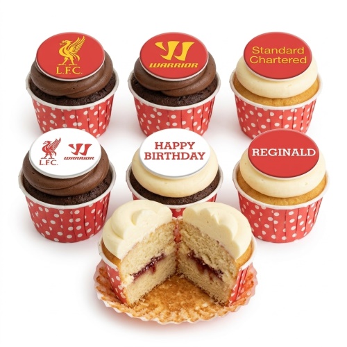 Liverpool FC themed birthday cupcakes with red and white toppers, some with chocolate and vanilla frosting and a jam filling.