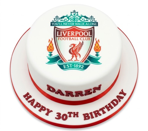 Round white fondant cake with Liverpool Football Club crest and red ribbon, with space for custom name and age.