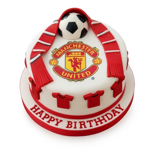 Round two-tier Manchester United football birthday cake with club crest, football, and red scarf.