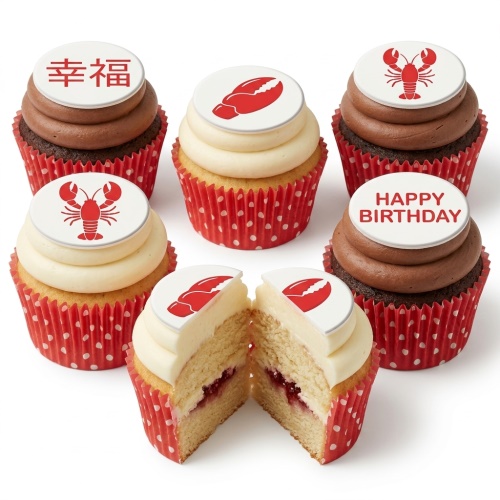 Six cupcakes with red lobster and "Happy Birthday" toppers, in red polka dot wrappers.