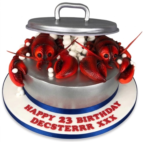Round silver cake with red lobsters emerging from a pot, with white decorations and a blue ribbon.
