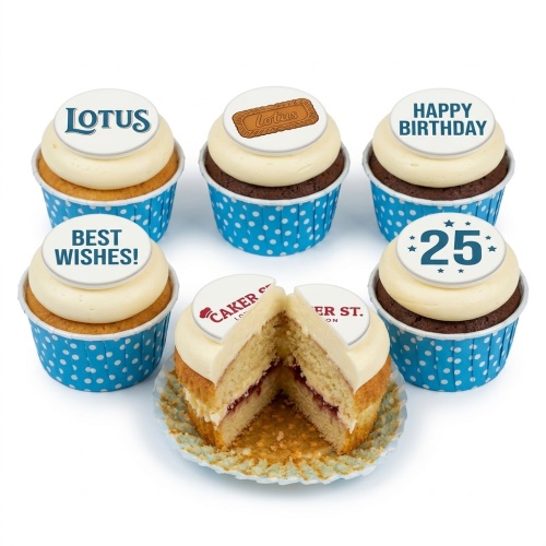 A set of six Lotus Biscoff themed birthday cupcakes with white frosting and blue polka dot wrappers, featuring custom age and message toppers.