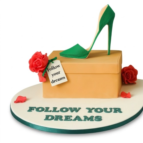 Elegant high heel shoe cake on a shoebox with red roses and a custom message tag.