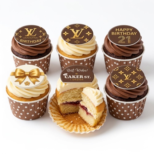 Louis Vuitton inspired birthday cupcakes with gold LV logo toppers, a gold bow, and 'Happy Birthday' messages.