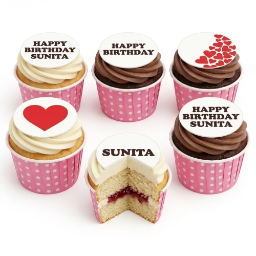 Cupcakes with white and chocolate frosting, pink polka dot cases, and white toppers with red hearts and 'Happy Birthday' messages.