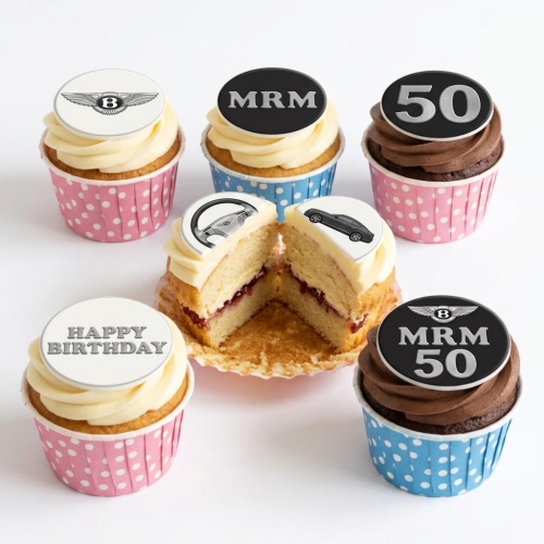Cupcakes with Bentley logo, car, steering wheel, and 'Happy Birthday' toppers.