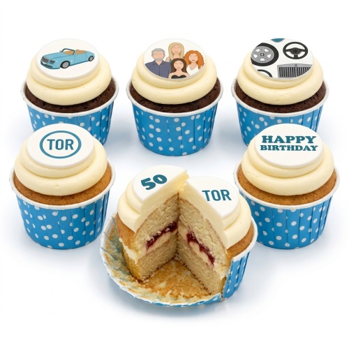 Assorted birthday cupcakes with car, family, and custom age toppers in blue polka dot cases.