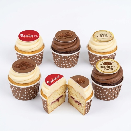 Assortment of chocolate and vanilla cupcakes with chocolate bar, Ferrero Rocher style, 'Sweet Celebration', and 'Chocolate Heaven' themed toppers.