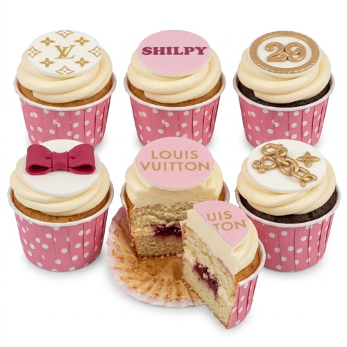 Louis Vuitton inspired cupcakes with pink and gold decorations, including a bow, chain, custom age topper, and personalised name disc.