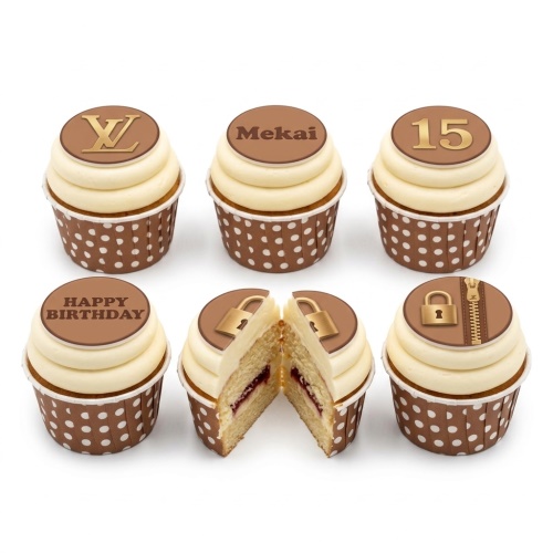Set of designer birthday cupcakes with cream frosting, brown polka dot wrappers, and luxury fashion-inspired toppers including LV logo, lock, zipper, Happy Birthday, custom name, and age.