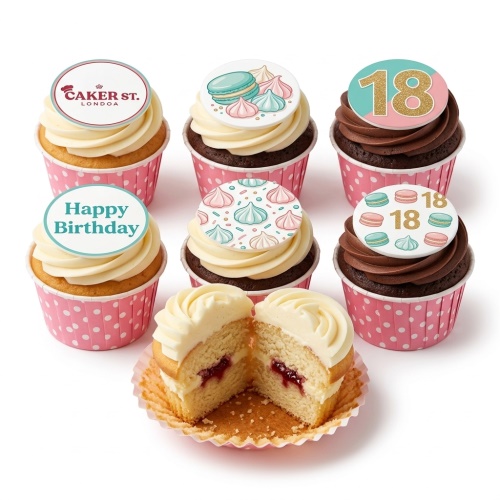 Assortment of macaron and meringue decorated birthday cupcakes with a custom age topper.