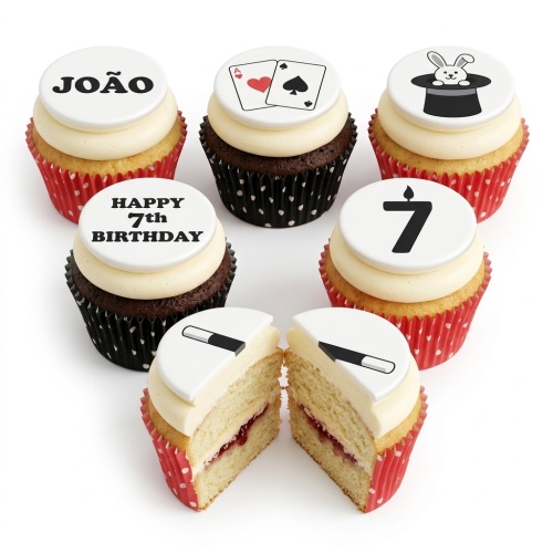 Magic theme birthday cupcakes with playing cards, rabbit in hat, and magic wand toppers.