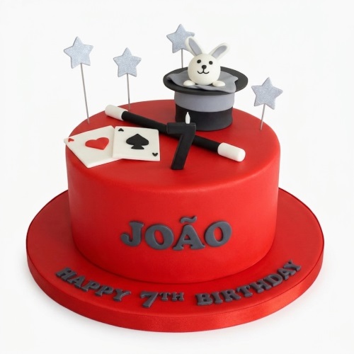 Red magic theme birthday cake with rabbit in top hat, wand, playing cards, and custom age candle