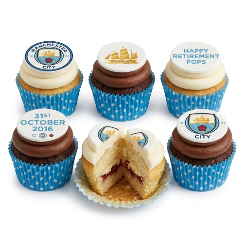 Set of Manchester City themed cupcakes with club crest and custom message toppers
