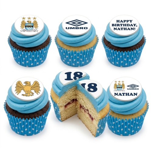 Manchester City football themed cupcakes with blue icing, club crests, Umbro logo, and custom age toppers on chocolate and vanilla sponges.