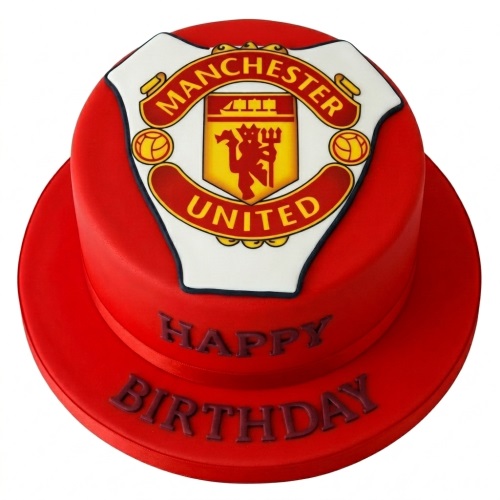 Round red Manchester United football birthday cake with club crest and "Happy Birthday" message.