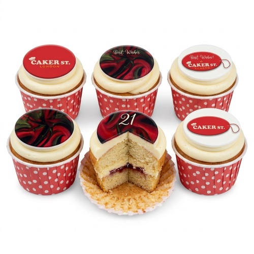 Six vanilla cupcakes with cream frosting, red polka dot cases, and edible toppers featuring red swirl designs, 'Best Wishes' text, 'Caker St. London' logo, and a custom age '21' topper.