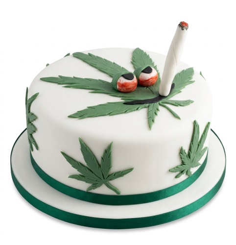 Round white cake with green cannabis leaves, bloodshot eyes, and a white joint decoration.