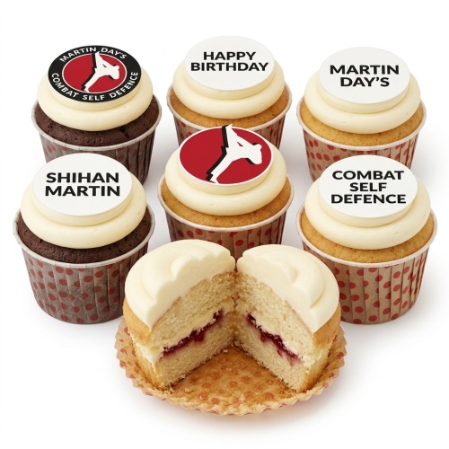 Six cupcakes with white icing and edible toppers featuring a red and black martial arts logo, 'Happy Birthday', and custom text. One cupcake is cut open revealing vanilla sponge and jam filling.