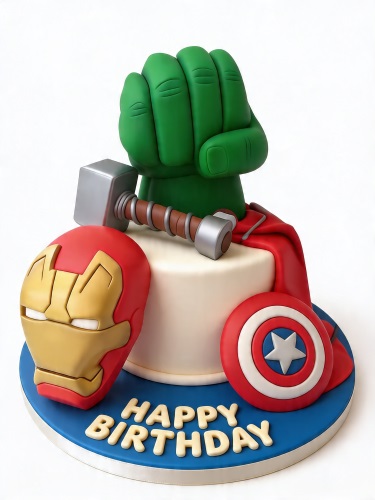White round single-tier cake with 3D Hulk fist, Thor's hammer, Iron Man mask, Captain America shield, and a red cape on a blue board with 'Happy Birthday' message.