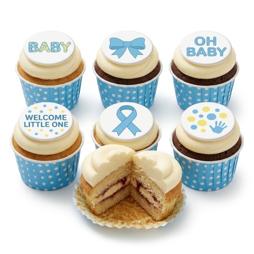 Selection of blue and white baby shower cupcakes with 'BABY', 'OH BABY', 'WELCOME LITTLE ONE' messages, a blue bow, blue ribbon, and blue handprint toppers, in polka dot cases.