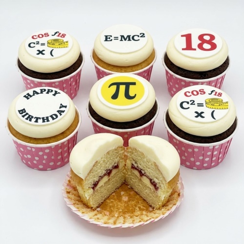 A box of six cupcakes with white frosting and edible science and maths themed toppers, including Pi symbol, E=MC², formulas, "Happy Birthday", and a custom age topper.