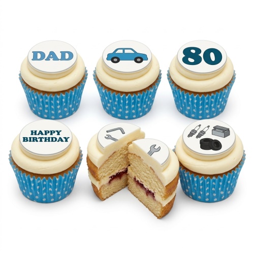 Set of vanilla cupcakes with white frosting and blue polka dot cases, topped with edible car, mechanic tools, and 'Happy Birthday' designs.