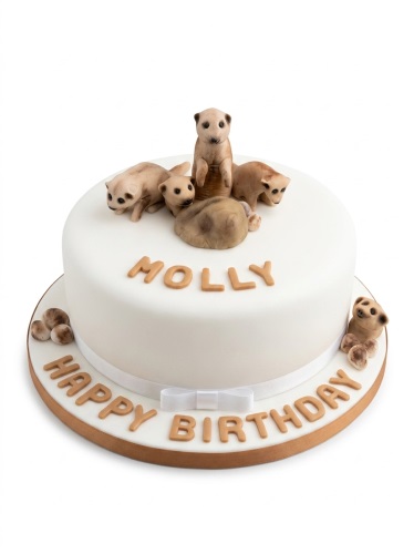 White fondant birthday cake with multiple brown meerkat figures and personalised name.