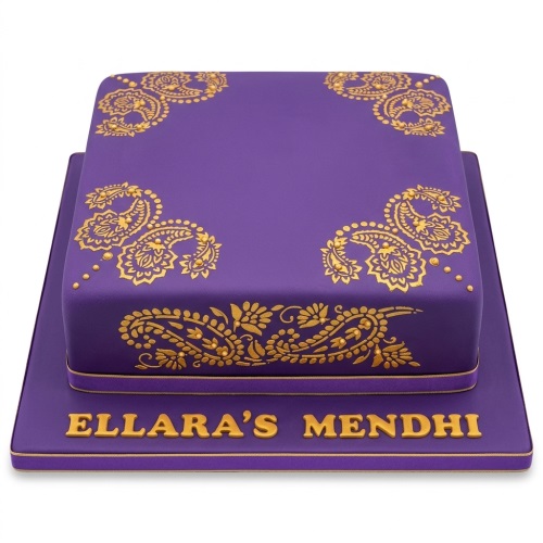 Two-tiered purple cake with gold henna-style paisley patterns and a custom message board.