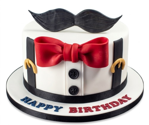 White round birthday cake with black moustache, red bow tie, black suspenders, and 'Happy Birthday' message.