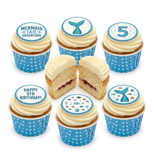 Six mermaid and under the sea themed cupcakes with white frosting and blue polka dot wrappers, one with a custom age 5 topper.
